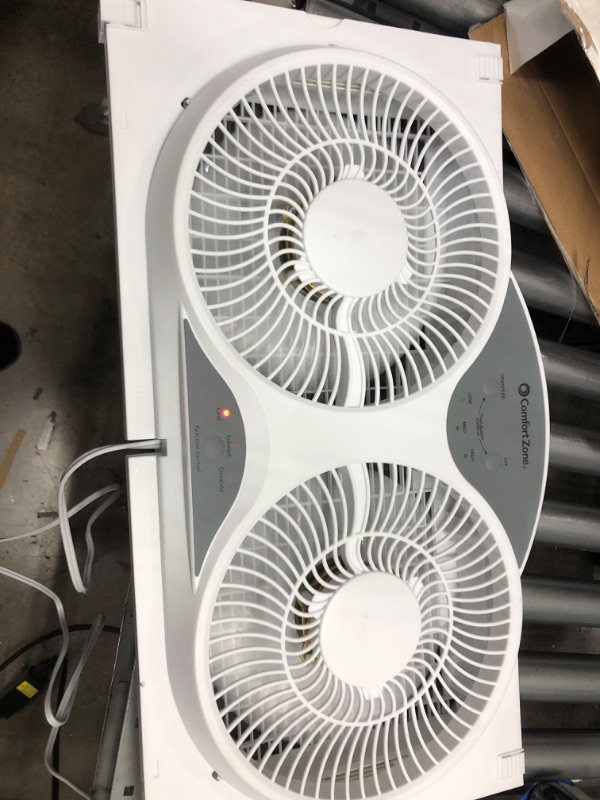 Photo 1 of Comfort Zone CZ310R 3-Speed 3-Function Expandable Reversible Twin Window Fan with Remote Control, Removable Cover