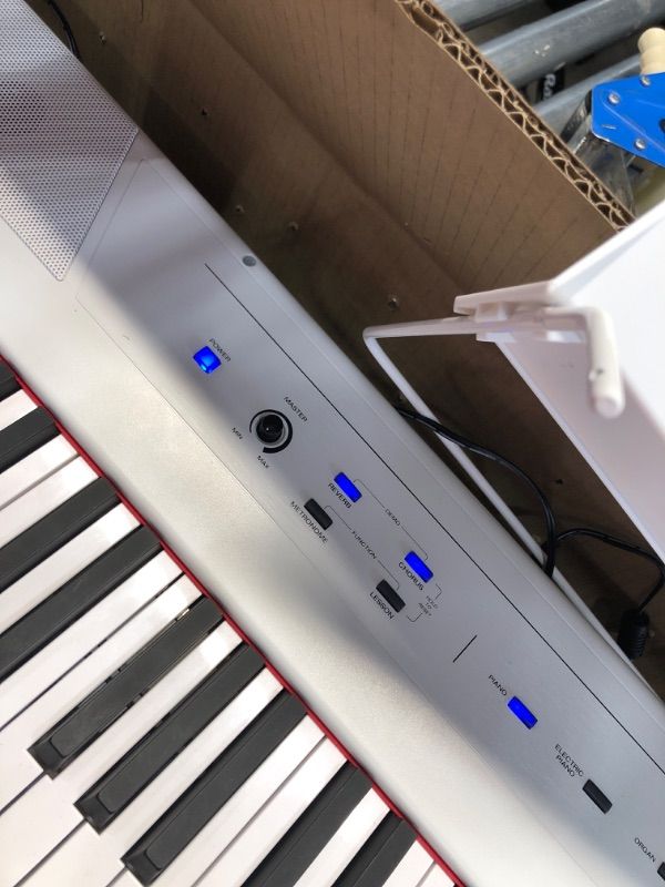 Photo 5 of Alesis Recital – 88 Key Digital Piano Keyboard with Semi Weighted Keys, 5 Voices, Piano Lessons, M-Audio Sustain Pedal and HDH40 Piano Headphones Recital White Piano + Sustain Pedal + Headphones