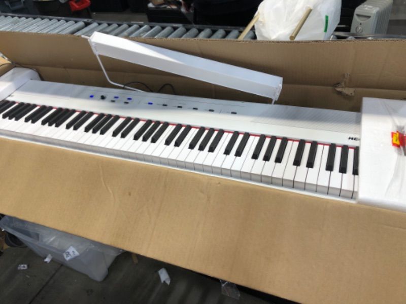 Photo 6 of Alesis Recital – 88 Key Digital Piano Keyboard with Semi Weighted Keys, 5 Voices, Piano Lessons, M-Audio Sustain Pedal and HDH40 Piano Headphones Recital White Piano + Sustain Pedal + Headphones