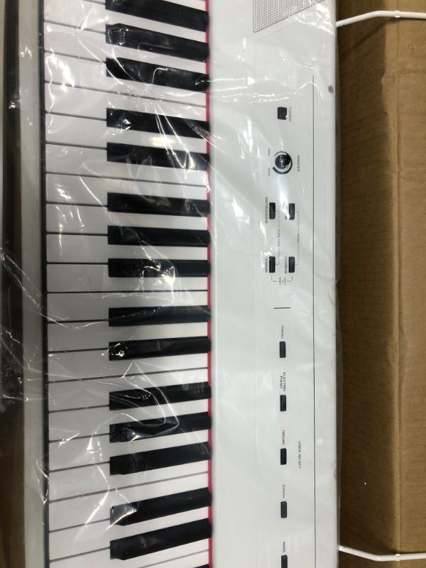 Photo 3 of Alesis Recital – 88 Key Digital Piano Keyboard with Semi Weighted Keys, 5 Voices, Piano Lessons, M-Audio Sustain Pedal and HDH40 Piano Headphones Recital White Piano + Sustain Pedal + Headphones