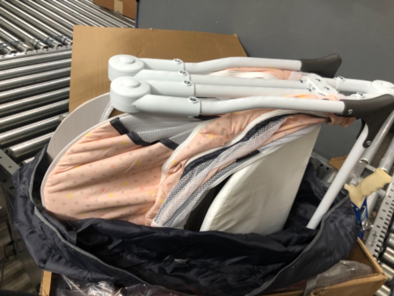Photo 1 of Dream On Me Karley Plus Portable Quick Fold Bassinet with Removable Canopy in Blush Pink