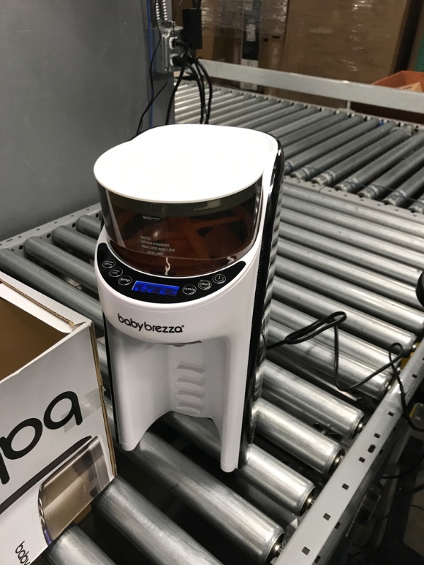 Photo 1 of New and Improved Baby Brezza Formula Pro Advanced Formula Dispenser Machine - Automatically Mix a Warm Formula Bottle Instantly - Easily Make Bottle with Automatic Powder Blending