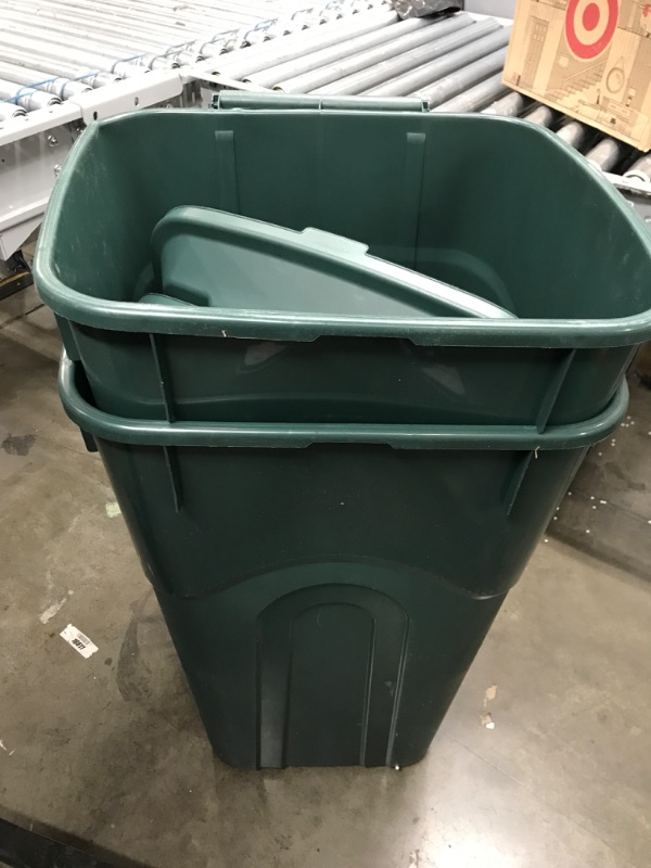 Photo 1 of 2 green 32 gallon trash cans