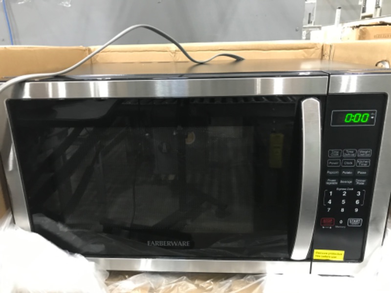 Photo 3 of Farberware Countertop Microwave 1.1 Cu. Ft. 1000-Watt Compact Microwave Oven with LED lighting, Child lock, and Easy Clean Interior, Stainless Steel Interior & Exterior
