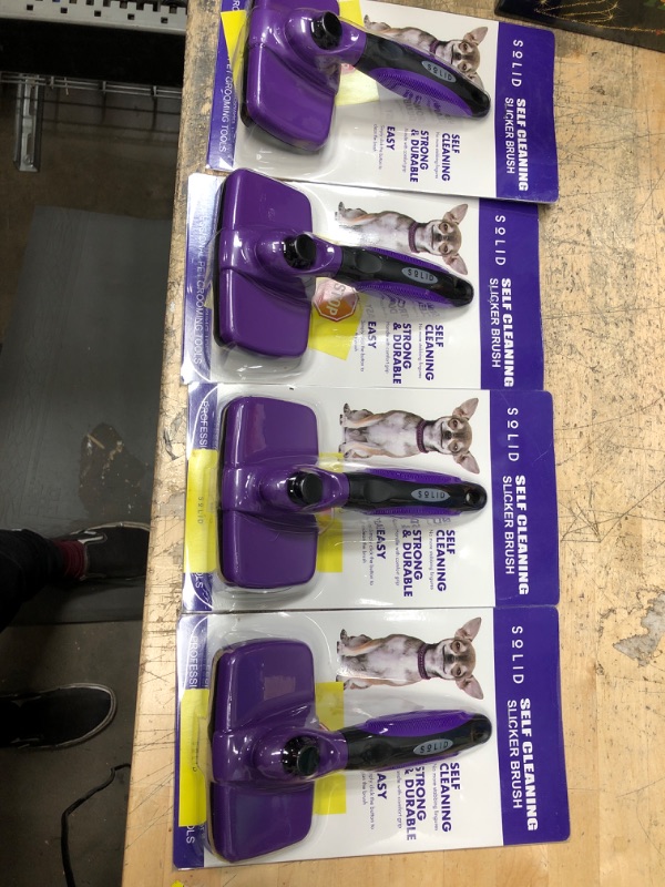 Photo 2 of **BUNDLE OF 4**
Pet Slicker Brush - Dog & Cat Brush for Shedding & Grooming - Dematting & Detangling Self-Cleaning Brushes for Dogs, Cats & Pets Purple