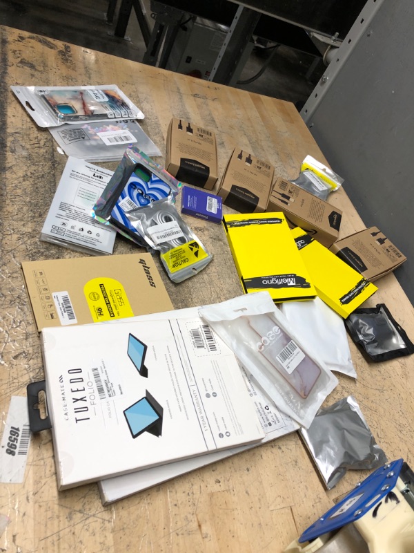 Photo 1 of miscellaneous bundle of phone cases and other electronic goods
