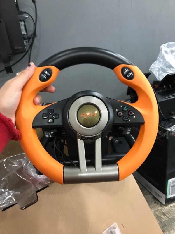 Photo 2 of PC Racing Wheel,PXN V3II 180 Degree Universal Usb Car Sim Race Steering Wheel with Pedals for PS3,PS4,Xbox One,Xbox Series X/S,Nintendo Switch (Orange)
