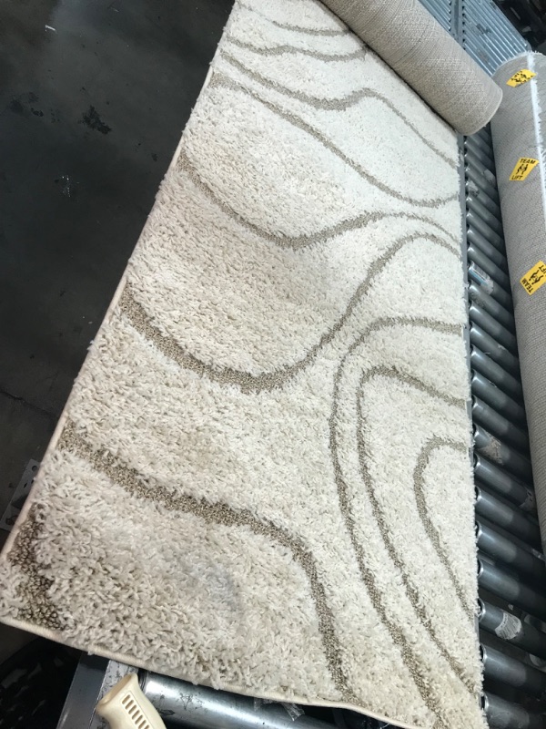 Photo 1 of **used-needs cleaning**
12' 6" x 2' x 8" white runner rug, please view photos
