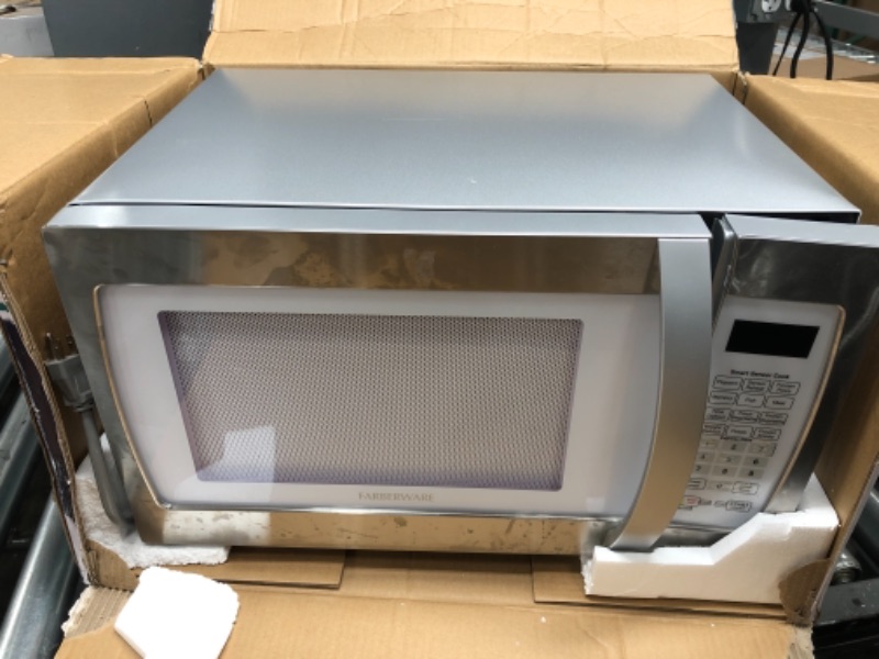 Photo 2 of ****FOR PARTS ONLY TURNS ON BUT DOES NOT WORK*** Farberware Countertop Microwave Oven 1.3 Cu. Ft. 1100-Watt with Smart Sensor Cooking, ECO Mode and Green LED Lighting, Child Lock, Easy Clean Black Interior, Retro White and Platinum Copper