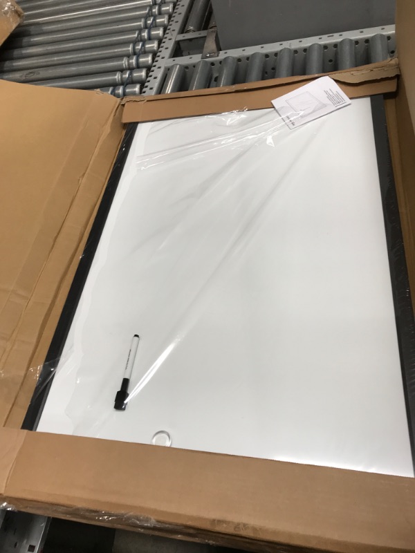 Photo 1 of Amazon Basics Magnetic Dry Erase White Board, 35 x 23-Inch Whiteboard - Black Wooden Frame 23"x35" Magnetic, Wood Frame