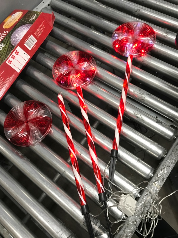 Photo 2 of *Tested/One has Major Damage-See Photos* Alpine Corporation 28" H Outdoor Candy Cane Yard Stakes with Red and White LED Lights (Set of 3)