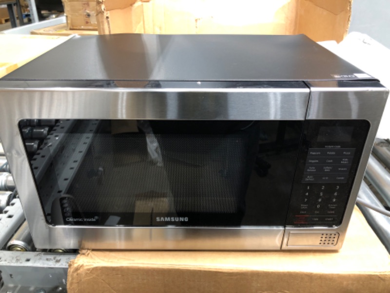 Photo 3 of *Doesn't Power On/Parts Only* SAMSUNG 1.1 Cu Ft Countertop Microwave Oven w/ Grilling Element, Ceramic Enamel Interior, Auto Cook Options, 1000 Watt, MG11H2020CT/AA, Stainless Steel, Black w/ Mirror Finish