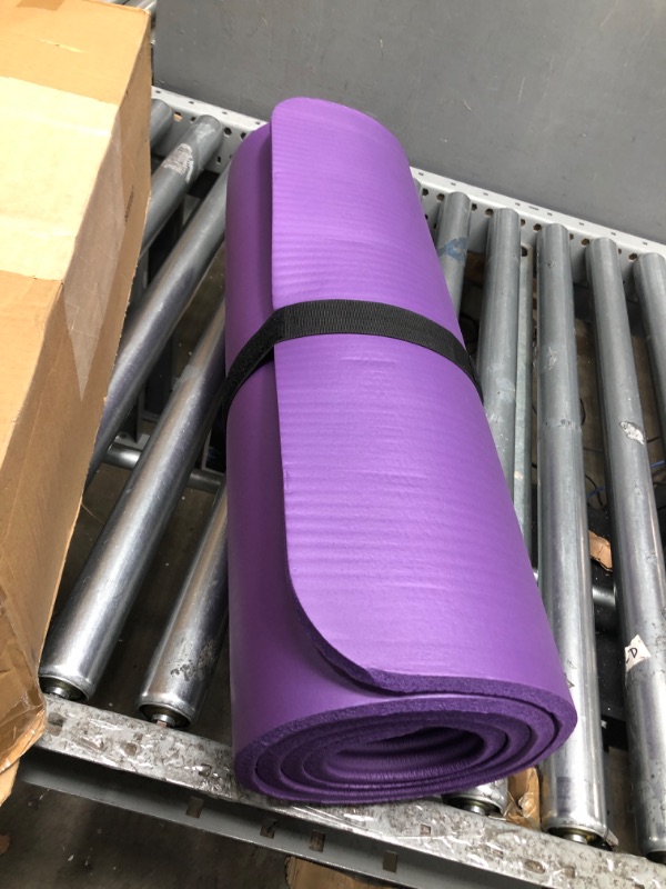 Photo 2 of Amazon Basics Extra Thick Exercise Yoga Gym Floor Mat with Carrying Strap - 74 x 24 x .5 Inches, Purple 