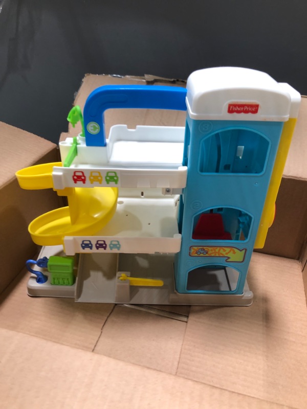 Photo 3 of Fisher-Price Little People Toddler Playset with Spiral Race Track, Elevator and 2 Wheelies Toy Cars, Helpful Neighbor’s Garage