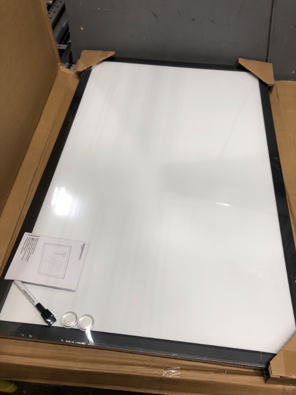 Photo 2 of Amazon Basics Magnetic Dry Erase White Board, 35 x 23-Inch Whiteboard - Black Wooden Frame 23"x35" Magnetic, Wood Frame