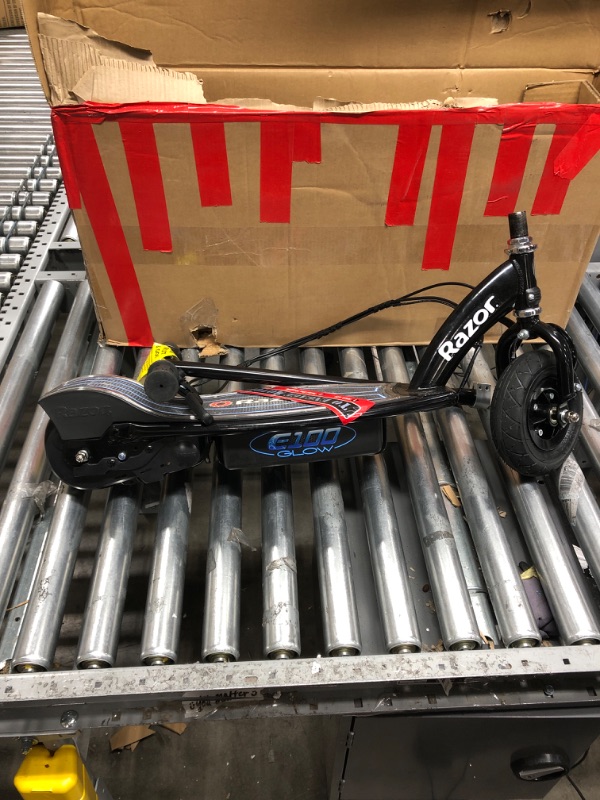 Photo 4 of Razor E100 Kids Ride On 24V Motorized Powered Electric Scooter Toywith Brakes and 8-Inch Pneumatic Tires, Ages 8 and Up Glow Black Scooter