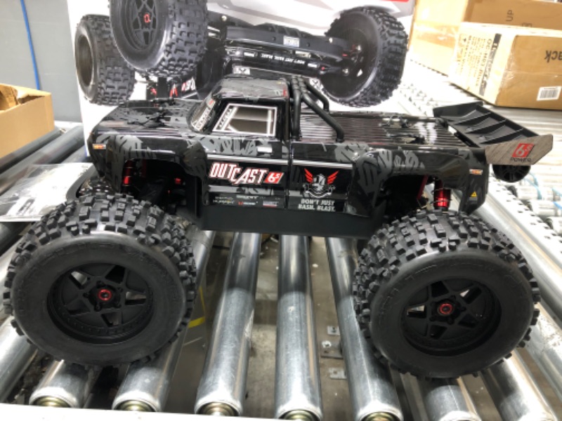 Photo 4 of ARRMA RC Truck 1/8 Outcast 6S BLX 4WD Extreme Bash Stunt Truck RTR (Battery and Charger Not Included), Black, ARA8710