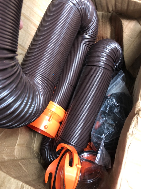 Photo 3 of Camco 20' (39742) RhinoFLEX 20-Foot RV Sewer Hose Kit, Swivel Transparent Elbow with 4-in-1 Dump Station Fitting-Storage Caps Included , Black , Brown 20ft Sewer Hose Kit Frustration-Free Packaging