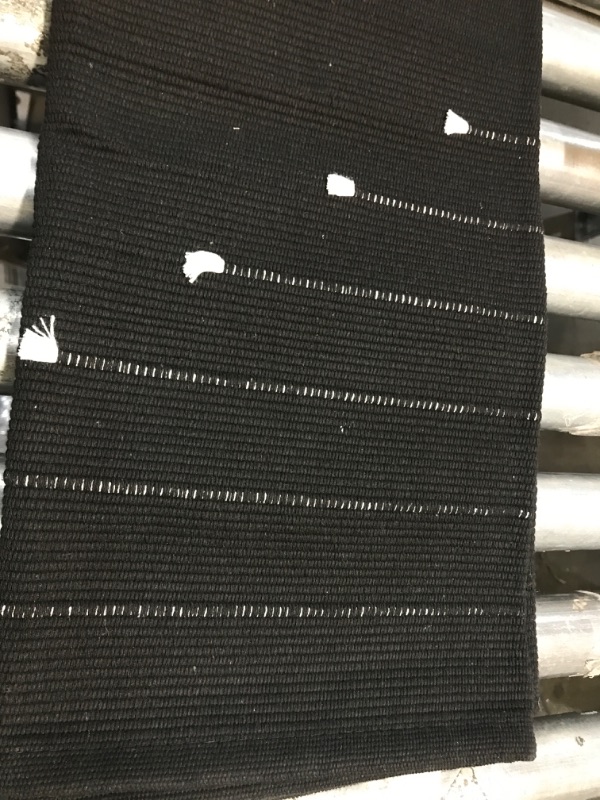 Photo 1 of 6'8"x4'8" black with white rug 