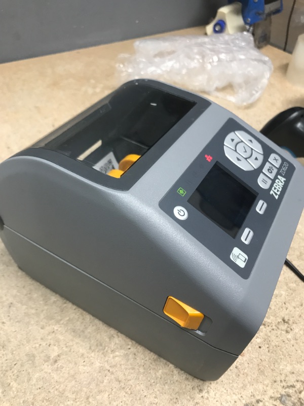 Photo 3 of ***TESTED POWERS ON*** Zebra - ZD620d Direct Thermal Desktop Printer with LCD Screen - Print Width 4 in - 203 dpi - Interface: WiFi, Bluetooth, USB, Serial, Ethernet - ZD62142-D01L01EZ (Renewed) ***MINOR SCUFFS ON BOTTOM SEE PHOTOS***