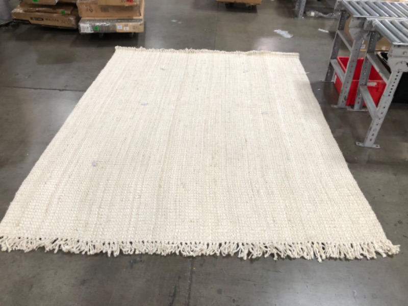 Photo 1 of **USED-NEEDS CLEANING**
7' 6" x 9' 10"  white natural rug, view photos for detail