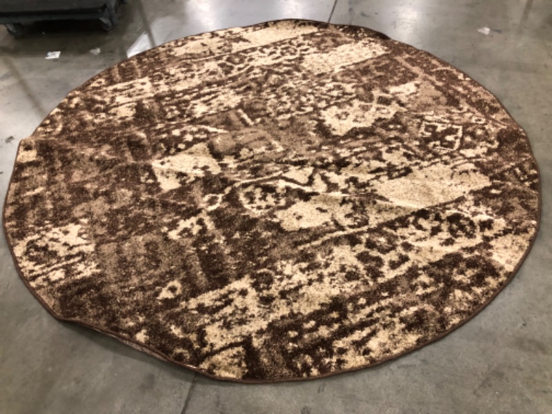 Photo 2 of **USED-NEEDS CLEANING** 
8FT ROUND BROWN RUG, VIEW PHOTOS!!!