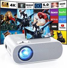 Photo 1 of HOMPOW PROJECTOR, NATIVE 1080P FULL HD BLUETOOTH PROJECTOR WITH SPEAKER, 9500 LUMENS OUTDOOR PORTABLE MOVIE MINI PROJECTOR COMPATIBLE WITH LAPTOP, SMARTPHONE, TV STICK, XBOX, PS5 WHITE
