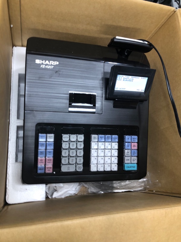 Photo 5 of **KEYS ARE TAPED TO INSIDE OF BOX**
Sharp XE-A207 Cash Register, Clear Multi-Line Operator Display, Guided Programming for Easy Set-Up, SD Card Slot for Program Backup Easy Data Transfer
