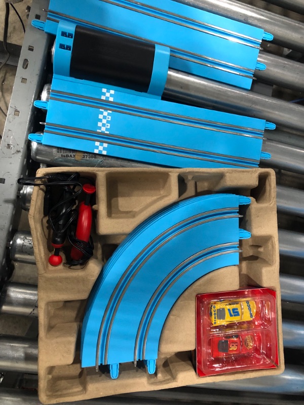 Photo 2 of Carrera First Disney/Pixar Cars - Slot Car Race Track - Includes 2 Cars: Lightning McQueen and Dinoco Cruz - Battery-Powered Beginner Racing Set for Kids Ages 3 Years and Up Disney Cars w/ Spinners