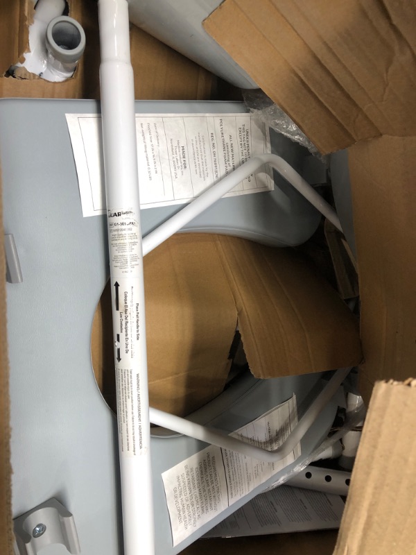 Photo 1 of Medline Drop Arm Commode, Swing Arm Rest for Easy Transfer, Padded Seat, Contains Chair, Pail, Lid, and Splash Guard, 350lb. Weight Capacity
