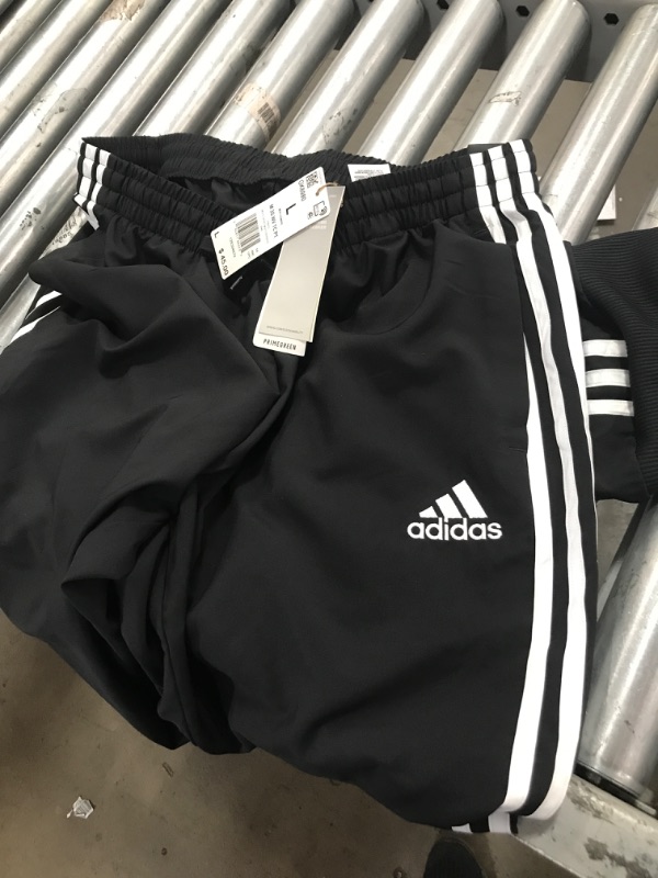 Photo 1 of adidas Men's Aeroready Essentials Tapered Cuff Woven 3-Stripes Pants Large Black