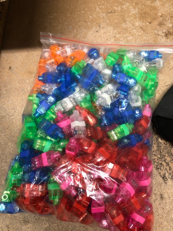 Photo 3 of **PARTY FAVORS**
up too 60 LED light up glasses multiple colors, red , blue, white, green, purple, pink. and a bag full of LED finger lights multiple colors