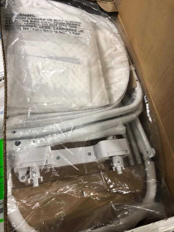 Photo 1 of Delta Children Silent Auto Gliding Elite Bassinet, Odyssey, One Size Bassinet White