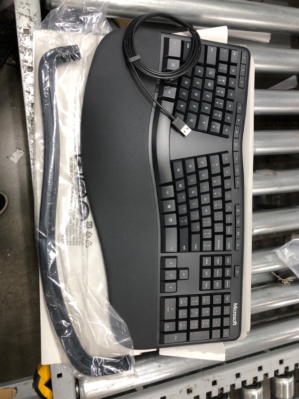 Photo 2 of Microsoft Ergonomic Keyboard - Black. Wired, Comfortable, Ergonomic Keyboard with Cushioned Wrist and Palm Support. Split Keyboard. Dedicated Office Key.