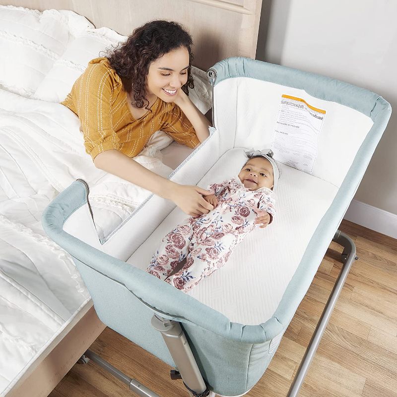 Photo 1 of Dream On Me Seashell Bassinet & Bedside Sleeper in Pearl, Lightweight Easy Folding and Height Adjustable Baby Bassinet, Mattress Pad Included, JPMA Certified
