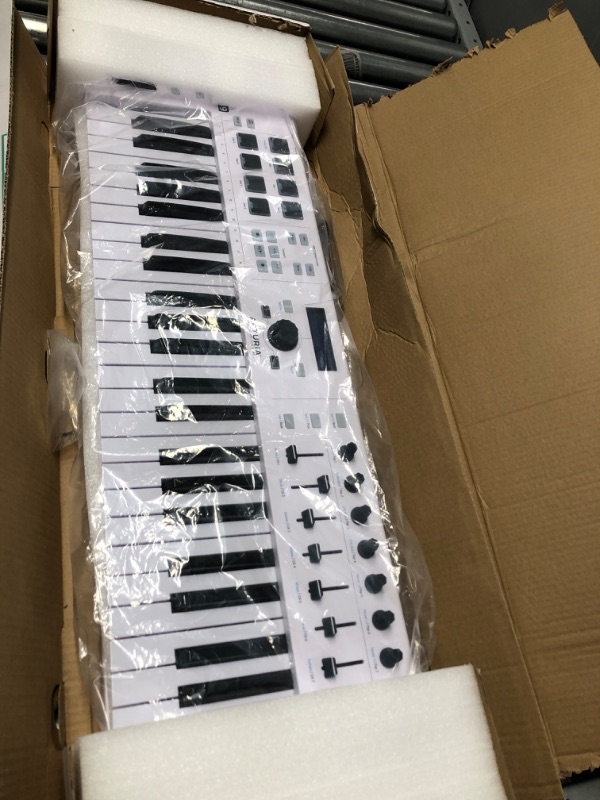 Photo 2 of Arturia KeyLab Essential 49 - 49 Key USB MIDI Keyboard Controller with Velocity Sensitive Synth Action Keys, 8 Drum Pads, 9 Faders, 9 Knobs and Analog Lab V Software Included