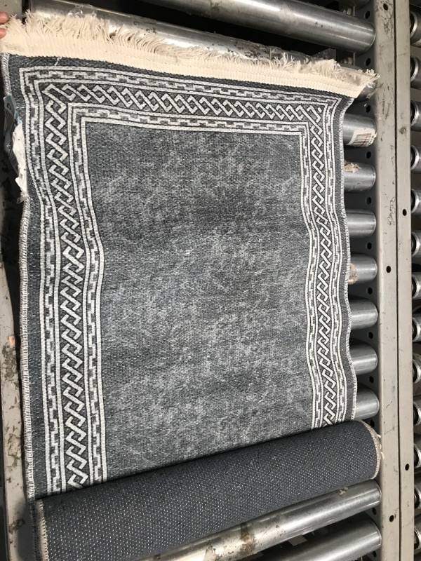 Photo 1 of 5ft x 1ft gray and white patterned rug 