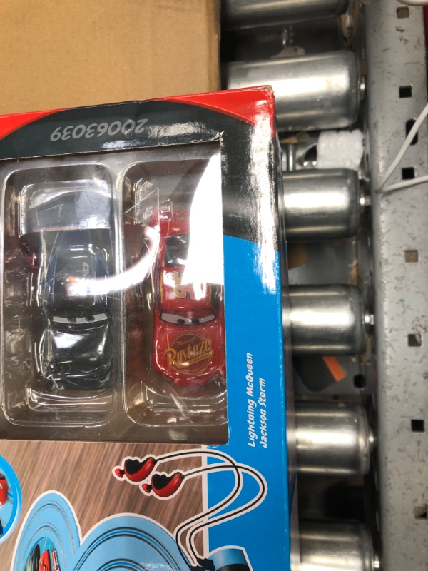 Photo 3 of Carrera First Disney/Pixar Cars - Slot Car Race Track - Includes 2 Cars: Lightning McQueen and Jackson Storm - Battery-Powered Beginner Racing Set for Kids Ages 3 Years and Up Disney Pixar Cars - Piston Cup