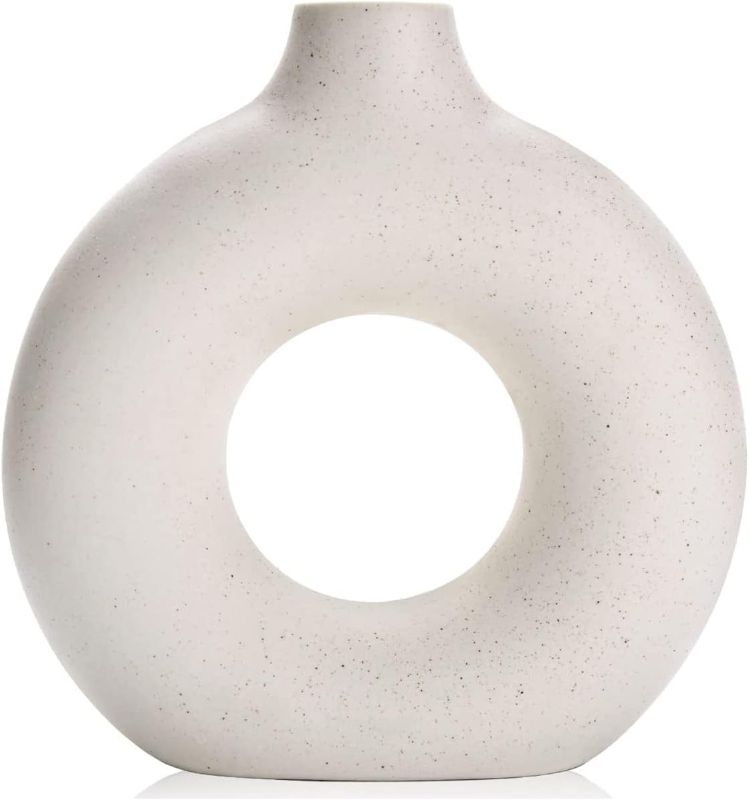 Photo 1 of 
Romehaha White Ceramic Vase,9''H Circle Vase Home Decor,Modern Hollow Round Flower Vase for Table,Bookshelf,Living Room,Office,Farmhouse,Wedding Decor
Color:White
Size:Large