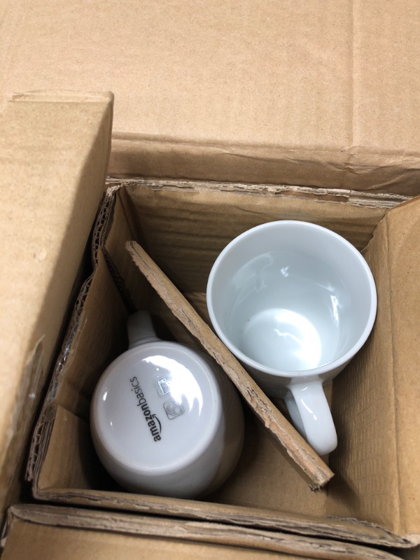 Photo 1 of Amazon Basics 16-Piece Porcelain Kitchen Dinnerware Set with Plates, Bowls and Mugs, Service for 4 - White