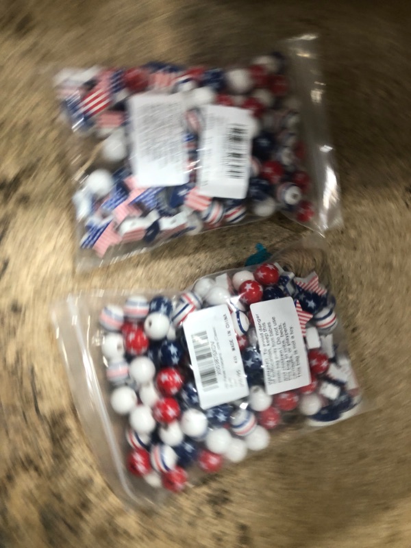 Photo 2 of **BUNDLE OF 2**  150 Pieces Independence Day Wood Beads 4th of July Wooden Beads America Blue White Red Stars Round Wood Beads Patriotic Wood Beads with Twine for Home DIY Tiered Tray Garland Decors (Cute Style)