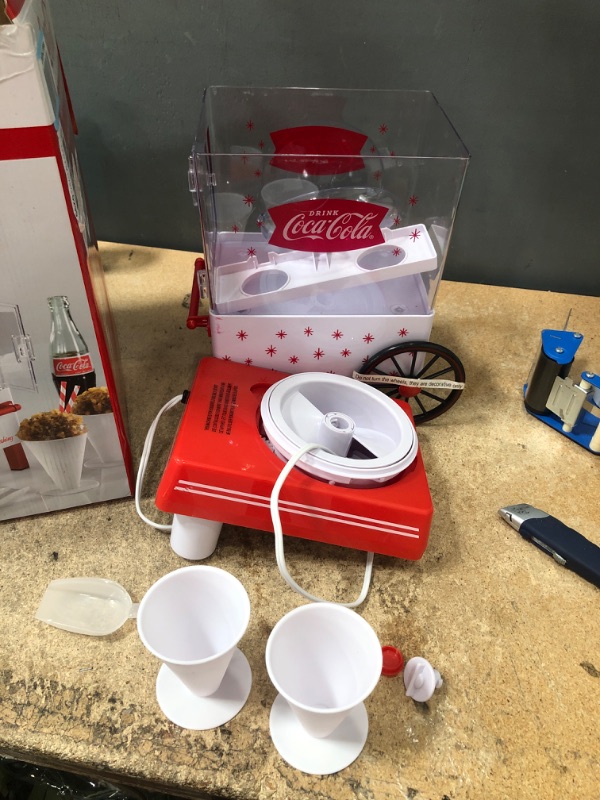 Photo 2 of ***POWERS ON*** Nostalgia SCM550COKE Coca-Cola Countertop Snow Cone Maker Makes & Ice Scoop – White/Red & now Cone Syrup Party Kit, Kool-Aid Shaved Ice, Multicolor Cone Maker Only + Ice Scoop