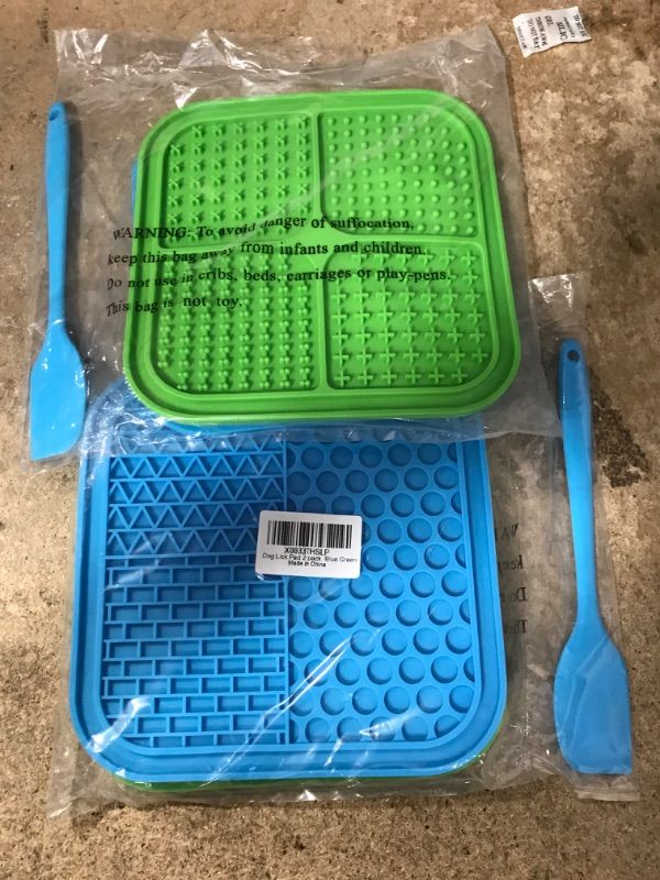 Photo 1 of 2 of- Ertzinla 2 Pcs Lick Mat for Dog and Cat, Dog Slow Feeding Licky Mat for Bathing Grooming Nailing Trimming, Food-Grade Blue & Green