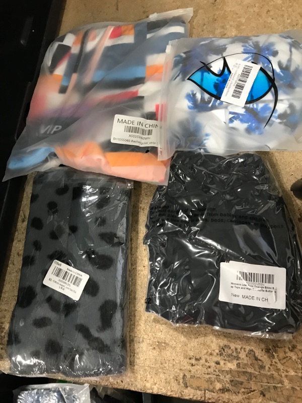 Photo 1 of BUNDLE OF ASSORTED CLOTHING ITEMS 