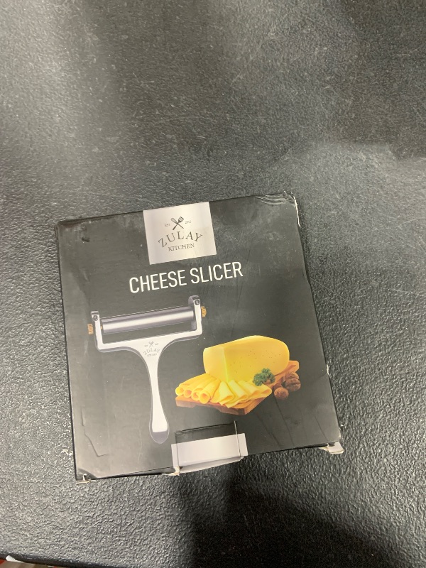 Photo 1 of Zulay Kitchen Stainless Steel Wire Cheese Slicer - Adjustable Hand Held Cheese Cutter with 2 Extra Wires - Premium Cheese Shaver for Mozzarella, Cheddar, Gruyere - Cheese Cutter with Wire (Silver)