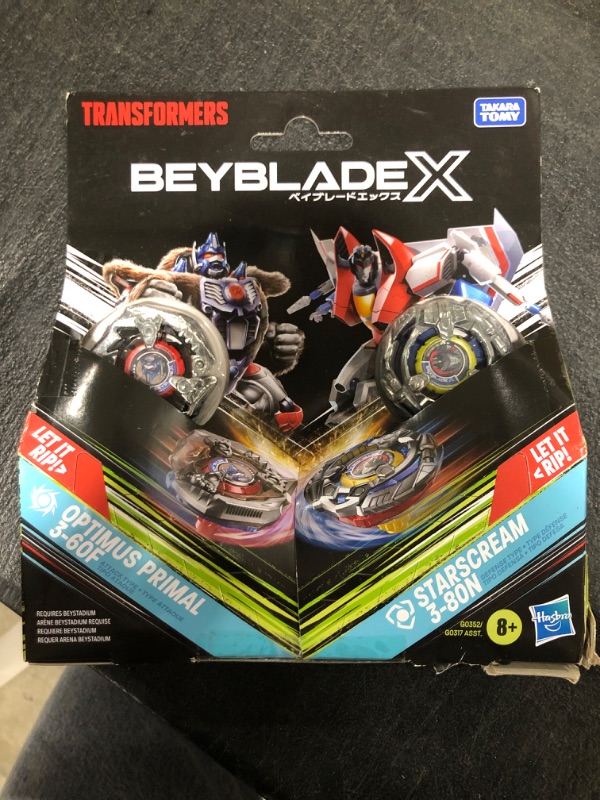 Photo 2 of Beyblade X Transformers Collab Optimus Primal 3-60F vs. Starscream 3-80N Multipack Set with 2 Tops & 2 launchers; Battling Top Toys for 8 Year Old Boys & Girls (Amazon Exclusive)