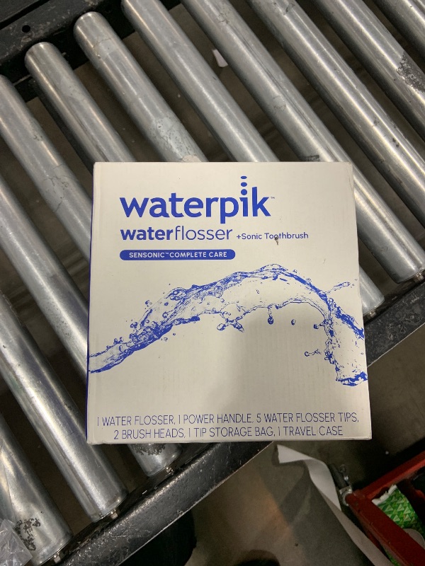 Photo 1 of Waterpik Sensonic Complete Care Water Flosser and Rechargeable Electric Toothbrush and Water Flosser Combo Set, CC-04, White, Packaging May Vary