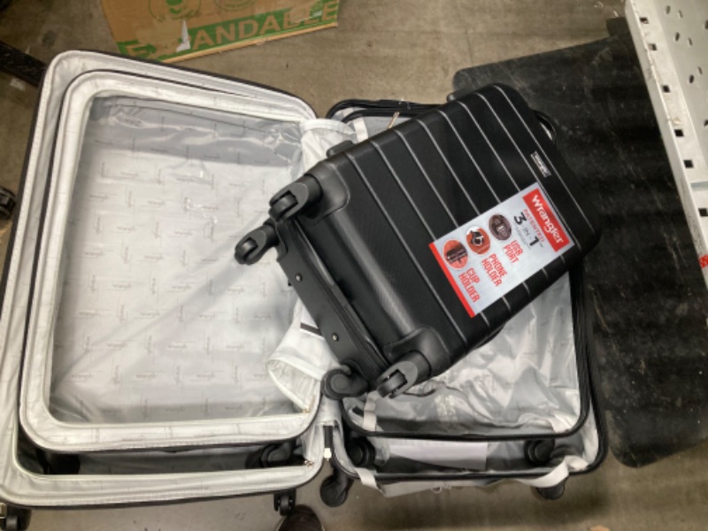 Photo 3 of **LARGE SUITCASE HAS A SMALL CRACK**
Wrangler Smart Luggage Set with Cup Holder and USB Port, Black, 3 Piece Set 3 Piece Set Black