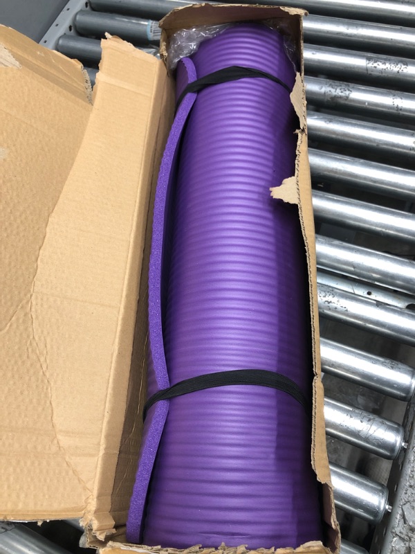 Photo 2 of Amazon Basics Extra Thick Exercise Yoga Gym Floor Mat with Carrying Strap - 74 x 24 x .5 Inches, Purple & High-Density Round Foam Roller for Exercise and Recovery - 36 Inch, Black