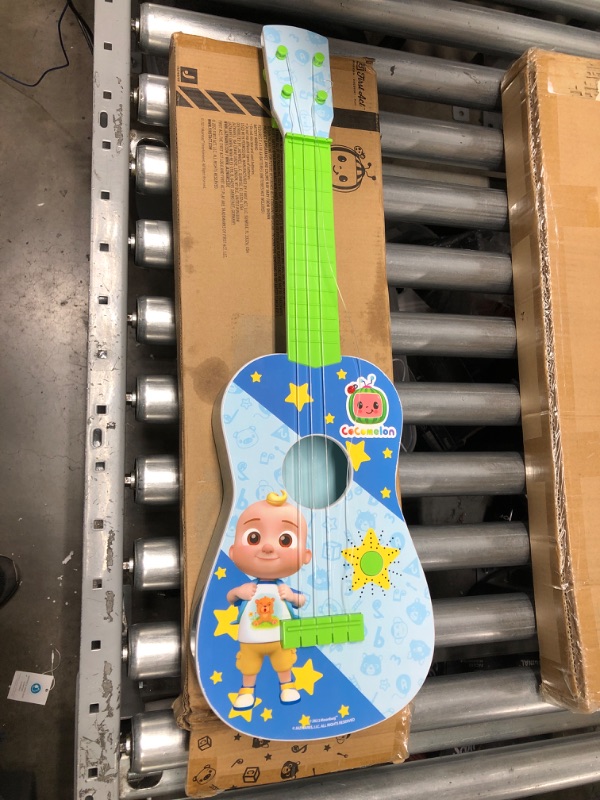 Photo 2 of CoComelon Musical Guitar by First Act, 23.5” Kids Guitar - Plays Clips of The ‘Finger Family’ Song - Musical Instruments for Kids, Toddlers, and Preschoolers